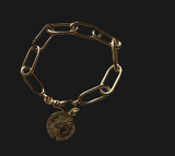Bracciale maglia larga e moneta