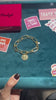 Bracciale maglia larga e moneta